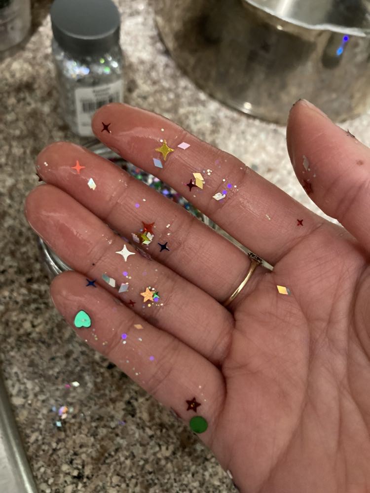 photo of hand with glitter on it